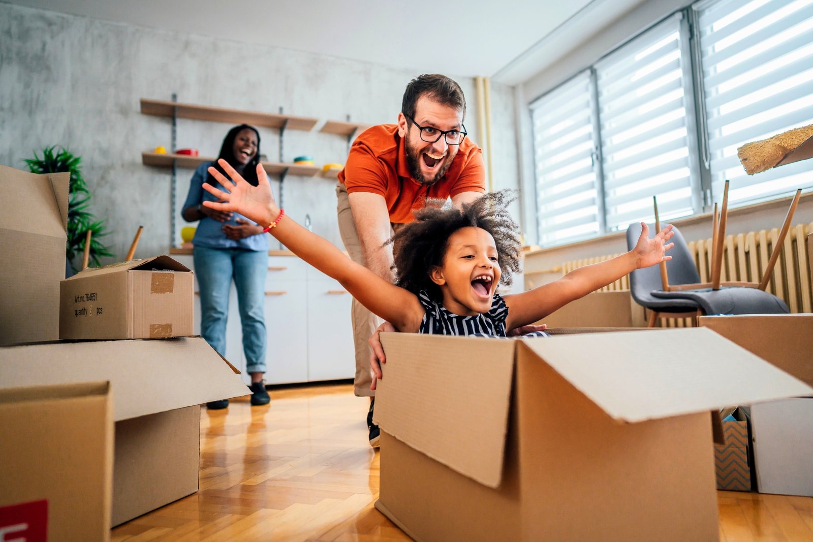 Families & Individuals Financial Planning | Mass Financial Management Family enjoying a new beginning together while planning for their financial future with personalized financial guidance.